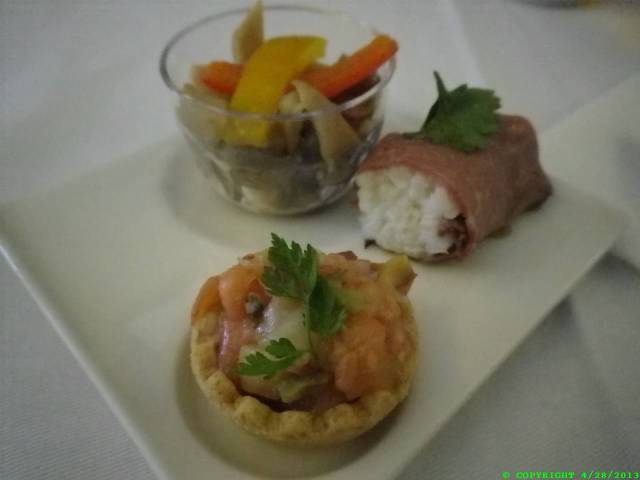 I cannot even describe what each item of the meals was. I think the item in the foreground was a sashimi mix in a little quiche crust. First behind was some sort of cured meat wrapped around some (?). Behind some mixed veggies.