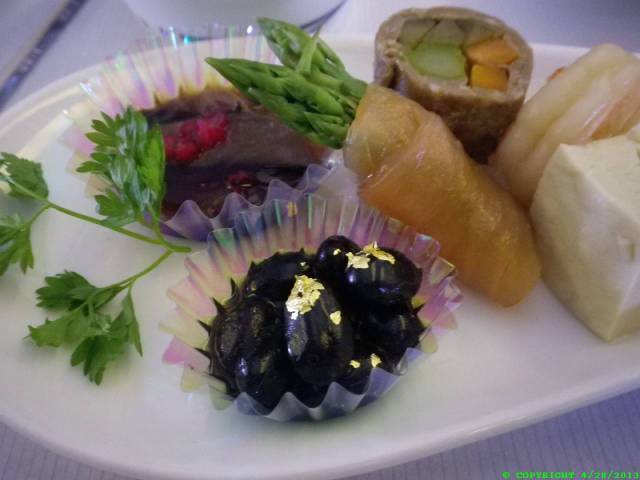 Flecks of gold on the sweet beans - Yes, that is real Ag (gold). This is the way l like to consume my heavy metal. The texture is like that of lead but with a brilliance unmatched by that baser metal. As it passes over the tongue one feels a sense of privilege and wonderment. I wonder how many toothless prospectors labored so that I could eat this end product of their efforts. Sort of a waste but considering the tiny amount of it, what we throw away in just one year of appliances, unwanted toys and packaging is more of a waste. I wonder if there is some other planet with a core made not of iron like our earth but one of pure gold?